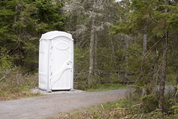 Commercial porta potty rental units at a business site in Homestead Fl